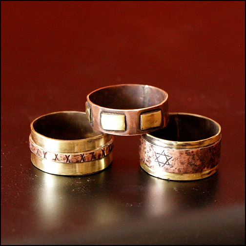Tři pánské prsteny